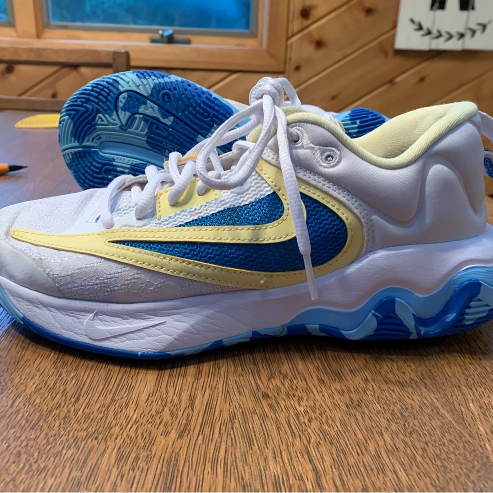 Nike White and Blue Athletic Shoes with Yellow Accents
